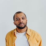 Man in White Crew Neck Shirt and Yellow Button Up Shirt